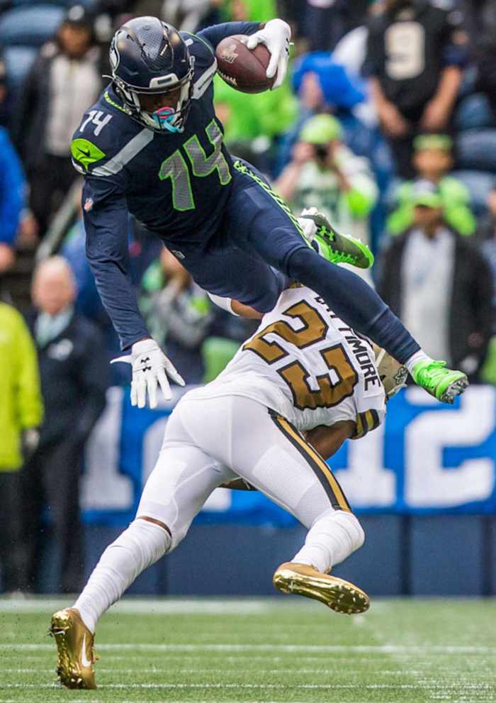 Saints CB Marshon Lattimore (23) takes down Seahawks WR DK Metcalf (14) after a short reception. Credit: Everett Herald